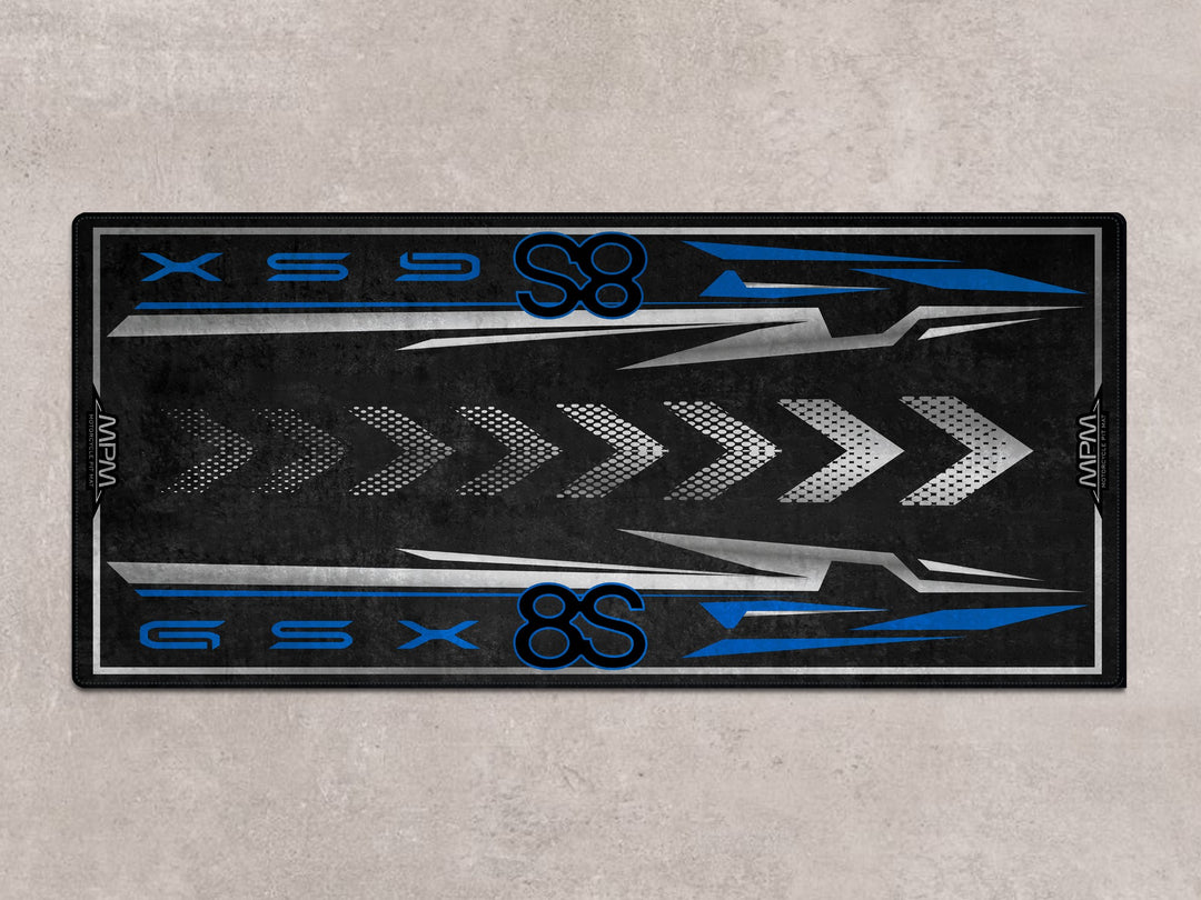 GSX-8S pit mat in black and blue. Premium motorcycle rug for parking mat setups, bike zone, and track prep areas.
