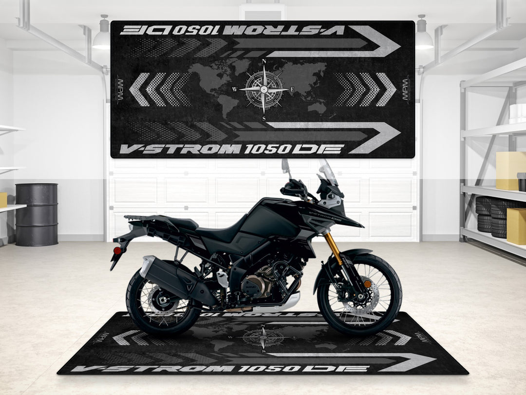 Black motorcycle parking mat for Suzuki V-Strom 1050DE. Rugged garage floor cover for rider essentials.