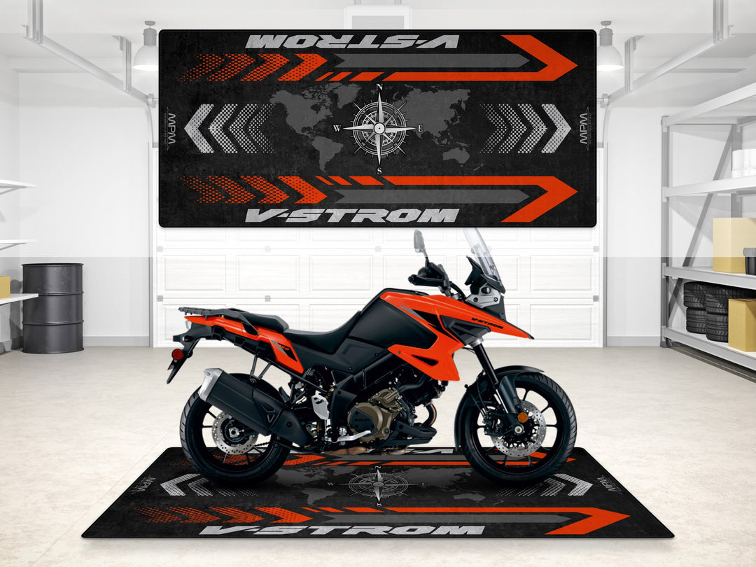 Blaze Orange V-Strom 1050 garage mat. Rugged floor cover for motorcycle display and parking zone.