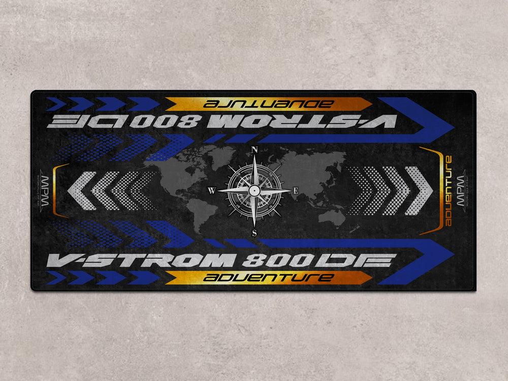 Garage floor protection mat for Suzuki V-Strom 800 DE. Durable pit rug for showroom or bike zone.