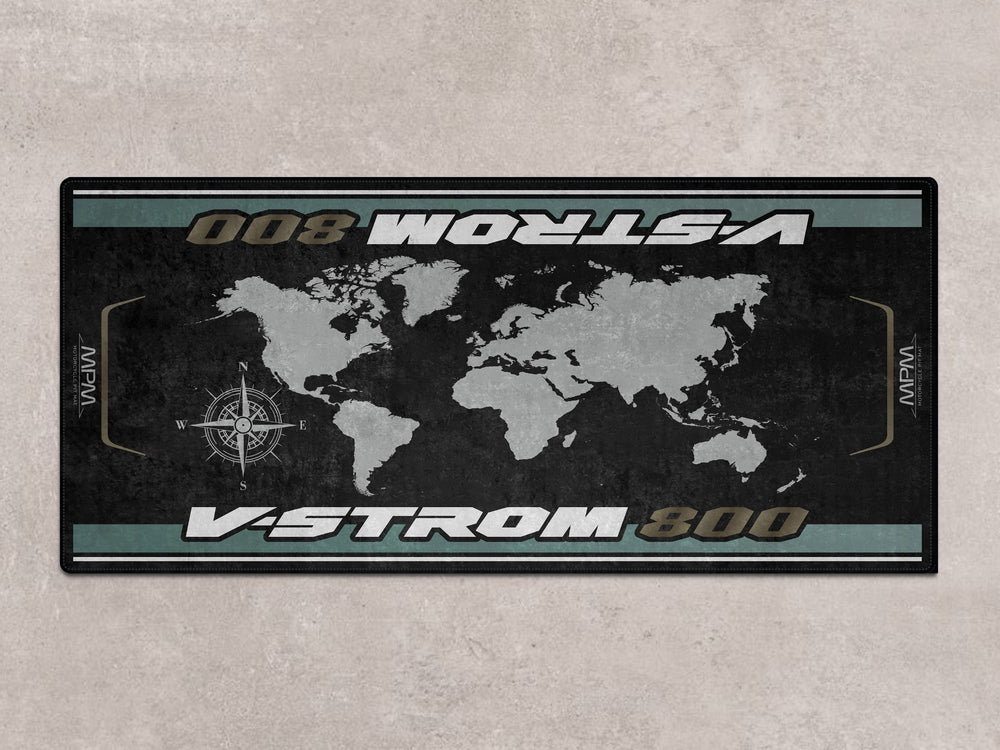 Metallic Matte Green V-Strom 800 parked on premium pit mat. Ideal rug for showroom or parking zone.