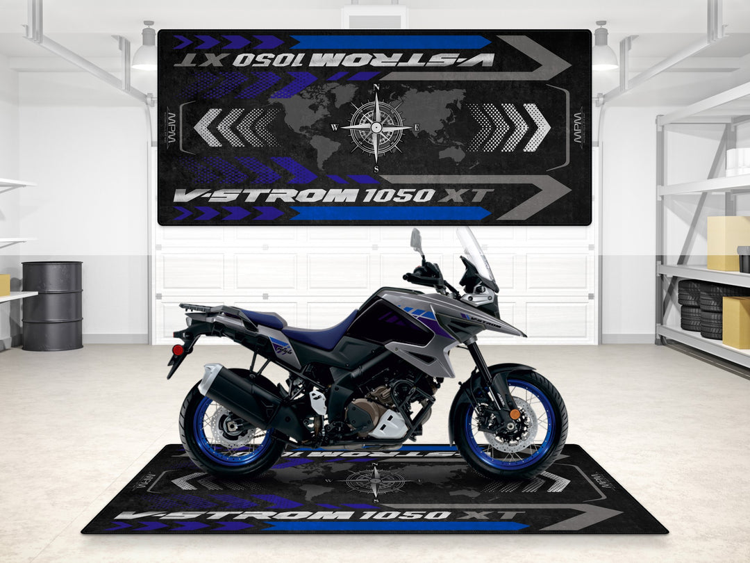 Suzuki V-Strom 1050 XT in Metallic Oort Gray No.3 on garage mat. Rug for motorcycle gear and parts zone.