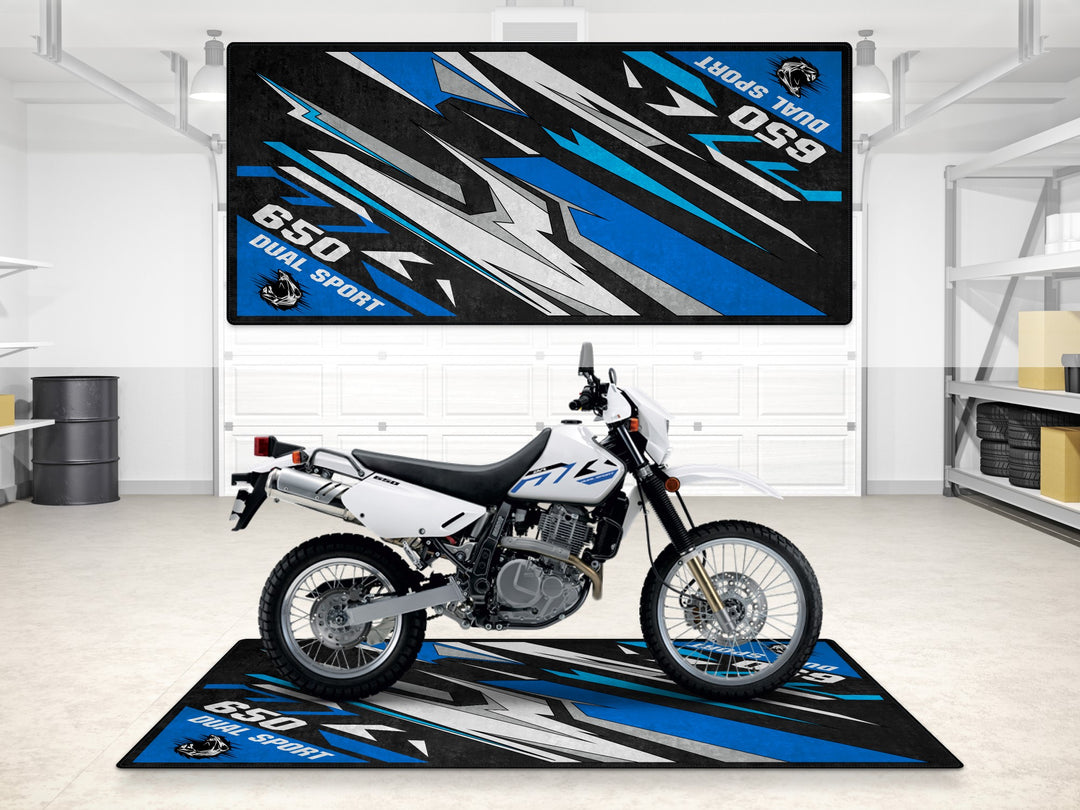 Suzuki DR650S in Special White on a bold garage mat. Perfect pit mat for dual sport motorcycle parking zones.