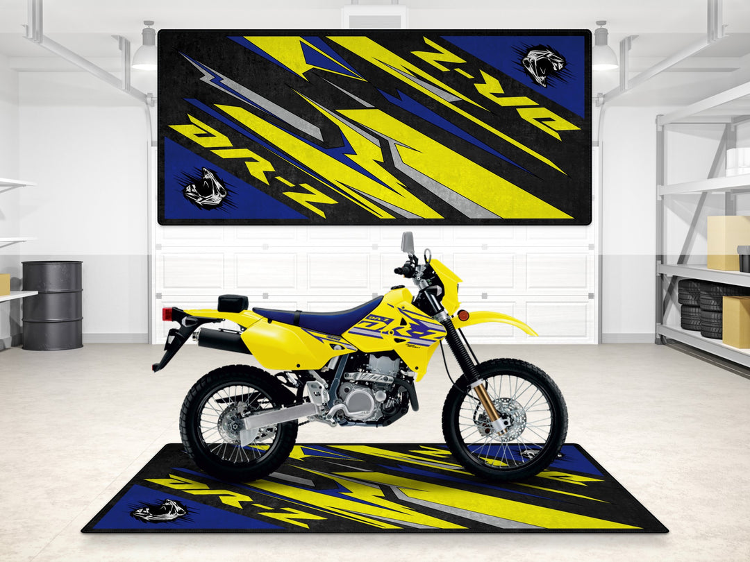 Suzuki DR-Z Champion Yellow dual sport on a garage mat. Perfect for parking mat setups in rider zones and workshops.