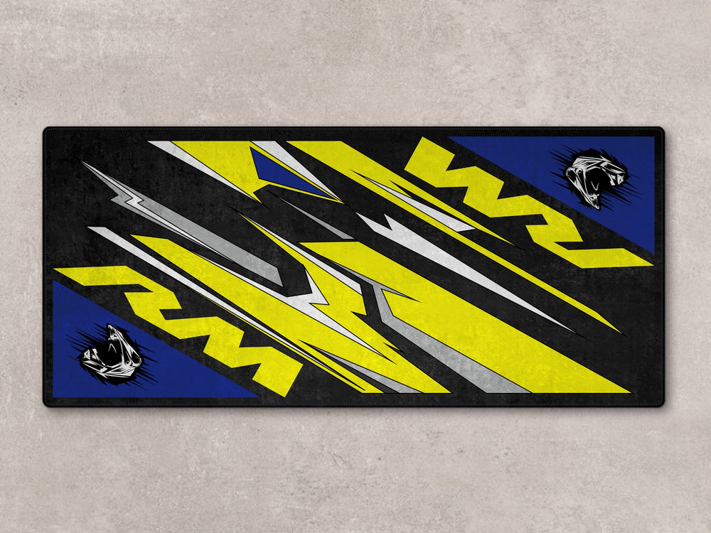 Off-road Suzuki RM displayed on Thermoplastic Rubber pit mat. Great for garage floor protection and track prep zones.