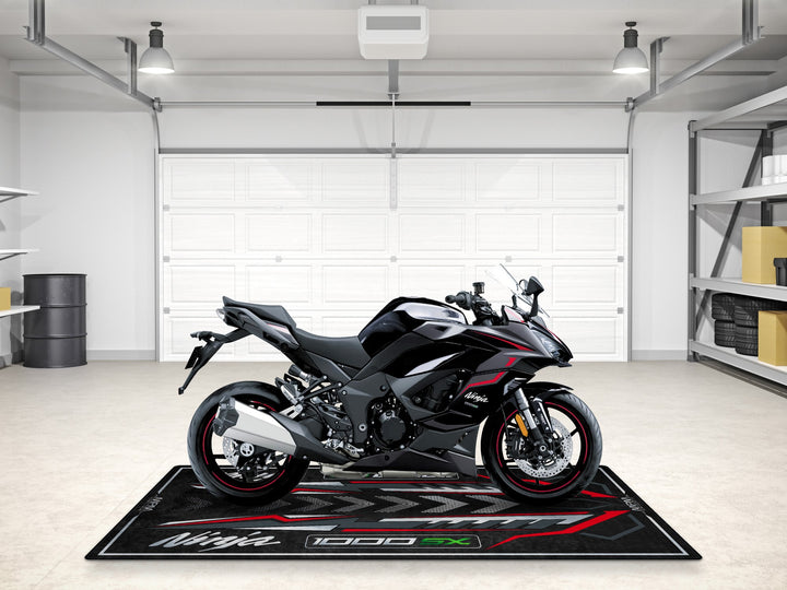Matte gray 1000SX motorcycle rug with bold arrows and red lines, perfect for garage floor protection and gear.