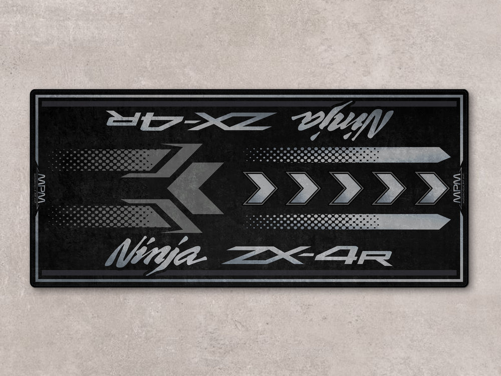 Stealth-inspired motorcycle rug for ZX-4R with Thermoplastic Rubber base, perfect floor cover for garage use.