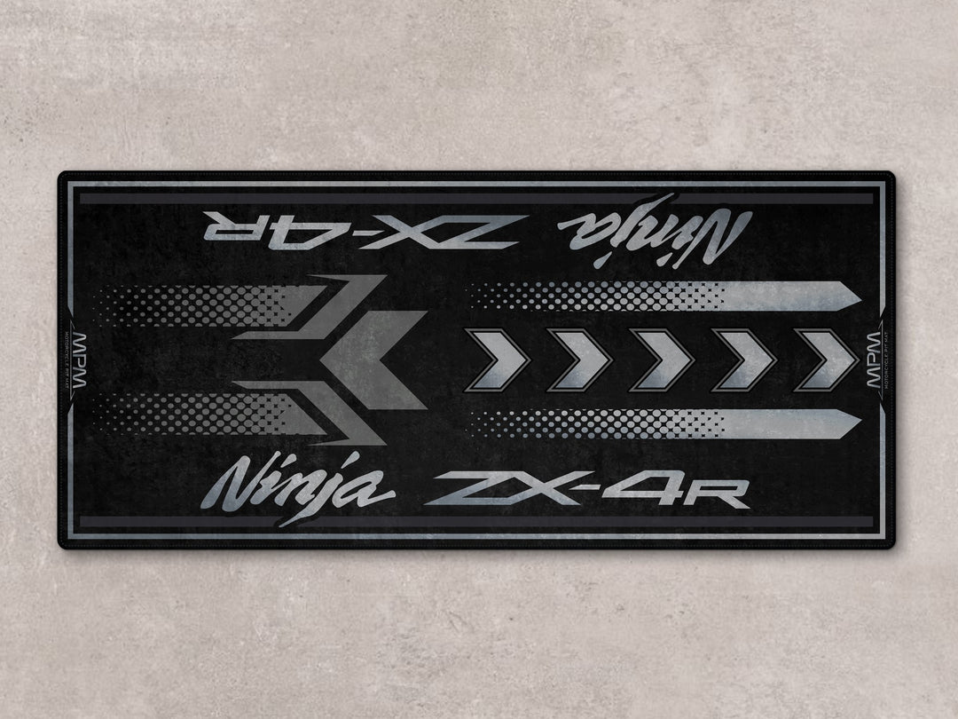 Stealth-inspired motorcycle rug for ZX-4R with Thermoplastic Rubber base, perfect floor cover for garage use.