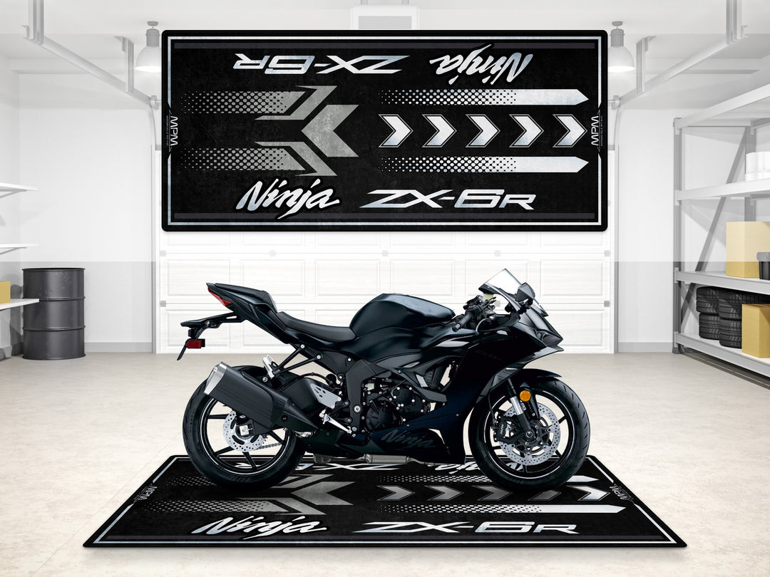 Metallic black ZX-6R garage mat with sleek arrow design, ideal pit mat for showroom and track prep setups.