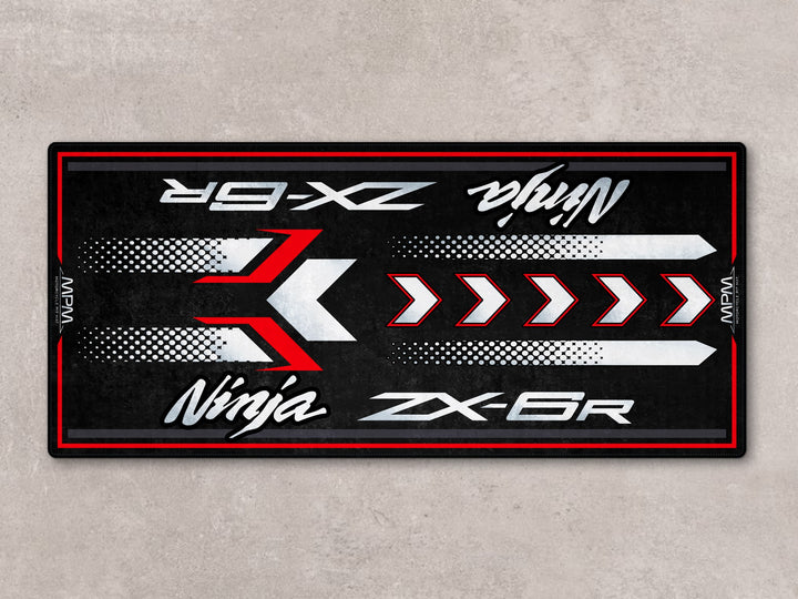 Sporty motorcycle display rug for ZX-6R with Thermoplastic Rubber base, ideal for garage floor protection.