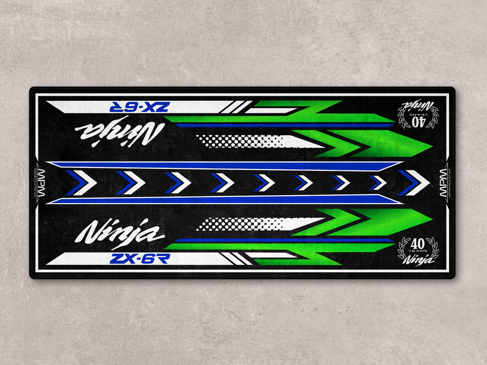 Commemorative ZX-6R motorcycle display rug with Thermoplastic Rubber base for garage floor protection.