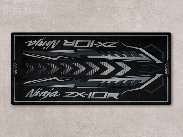 Flat spark black ZX-10R motorcycle display rug with Thermoplastic Rubber base for garage floor protection.