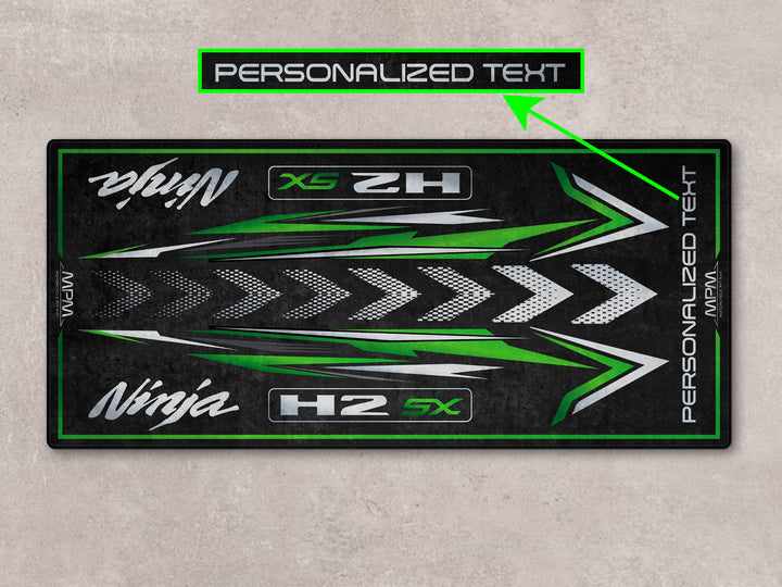 Track-ready motorcycle display rug for Ninja H2 SX. Durable garage floor protection for parts, gear, and gift lovers.