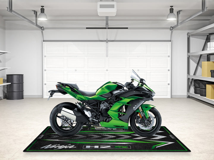 Superbike garage mat in metallic green. A stylish floor cover and carpet for track prep, racetrack, and motorcycle accessory setups.
