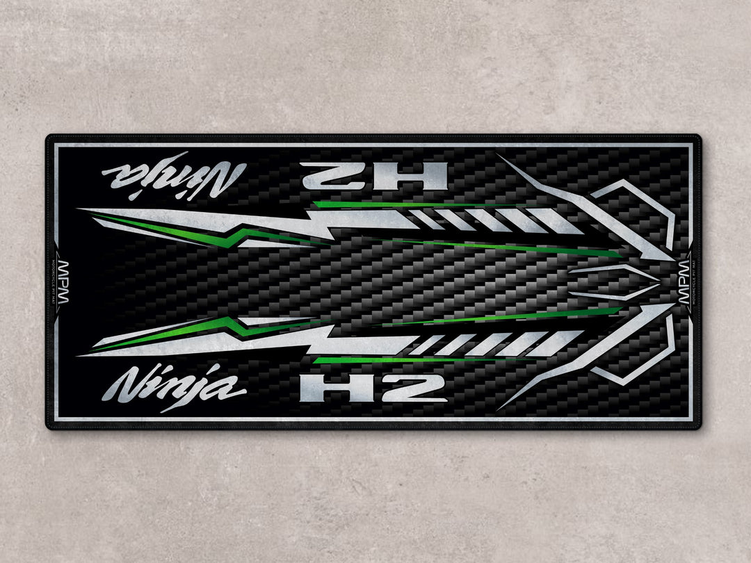 Ninja H2 parking mat with candy green streaks. Ideal showroom rug or racetrack prep floor cover for motorcycle display.
