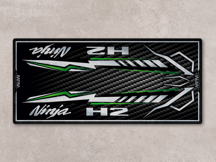 Ninja H2 parking mat with candy green streaks. Ideal showroom rug or racetrack prep floor cover for motorcycle display.