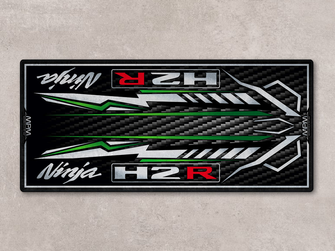 H2R parking mat with carbon-look finish. Custom pit rug ideal for motorcycle display, racetrack prep, or superbike garage.