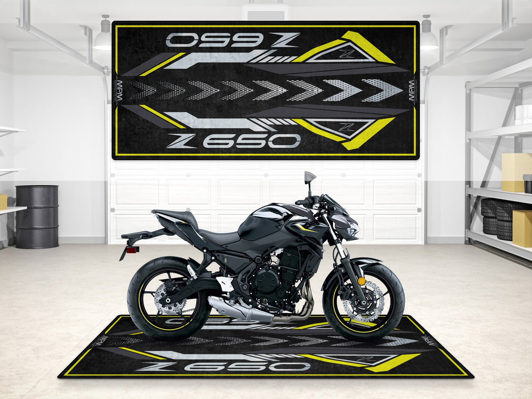 Z650 garage mat with yellow-gray racing theme. Durable pit mat and floor cover for motorcycle display.