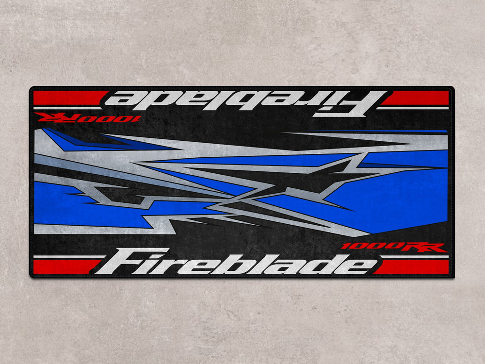 Fireblade pit mat with dynamic race-style design. A showroom-ready floor cover for bike zone or motorcycle gear display.