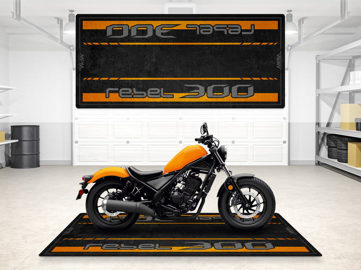 Rebel 300 garage mat in Nitric Orange. Durable parking mat and floor cover for motorcycle gear and garage setups.