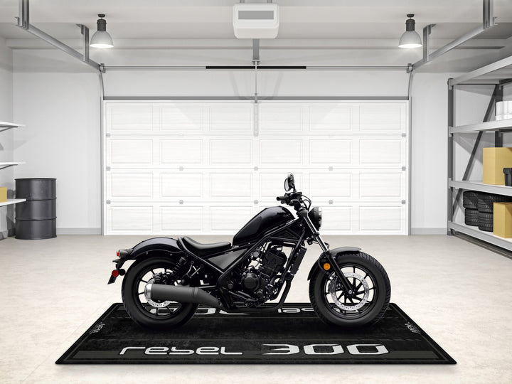 Motorcycle pit mat for Rebel 300 in Pearl Black. A premium floor rug for racetrack, bike zone, or accessory corner.