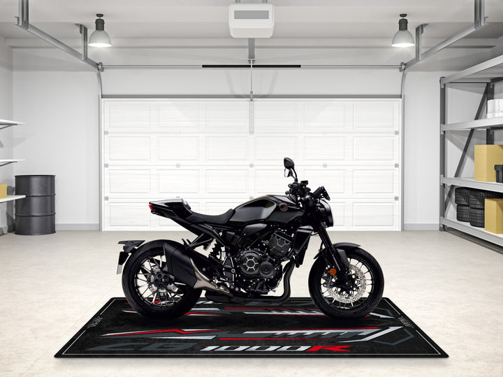 Upgrade your space with this CB1000R Black Edition garage mat. A bold pit rug for style, protection, and motorcycle display.