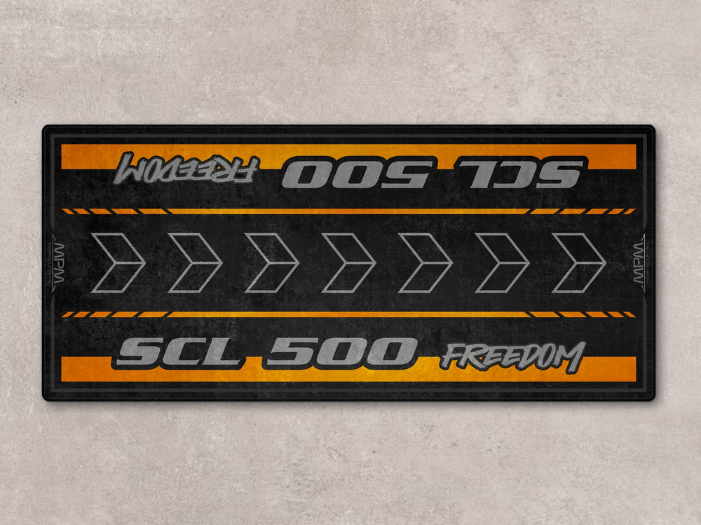 Thermoplastic Rubber pit mat for SCL500. Rug built for racetrack prep, showroom setups, or motorcycle gear and parts display.