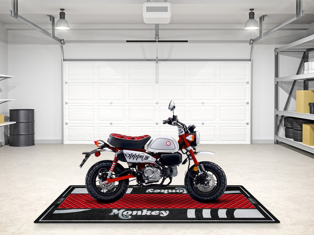 Honda Monkey parking mat in Nebula Red. Custom rug for superbike garage or Thermoplastic Rubber floor cover.