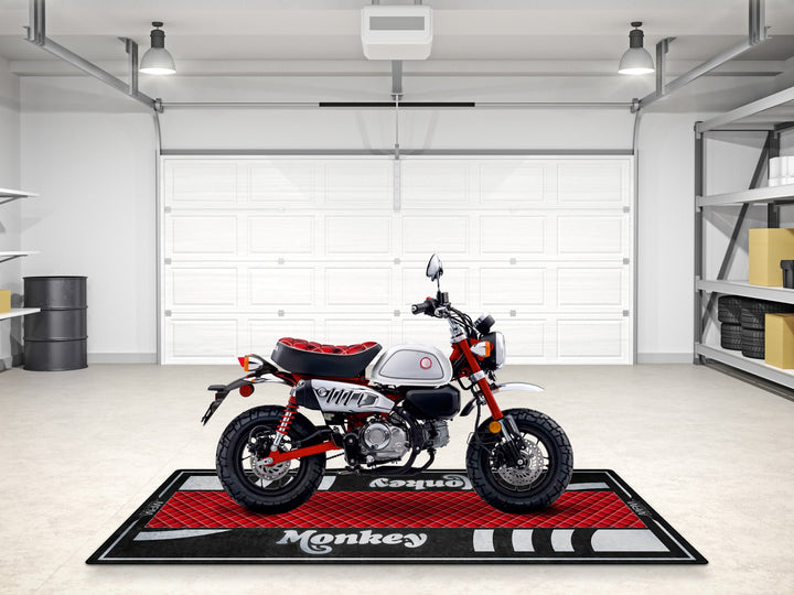 Honda Monkey parking mat in Nebula Red. Custom rug for superbike garage or Thermoplastic Rubber floor cover.