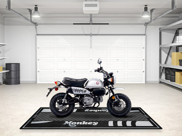 Show off your Honda Monkey in style – a premium motorcycle display mat with garage floor protection and a custom pit rug vibe.