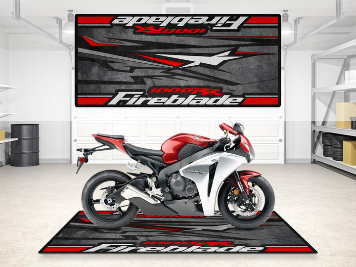 Garage mat for Honda CBR1000RR Fireblade in black and red. Rugged parking mat and floor cover for garage floor protection.