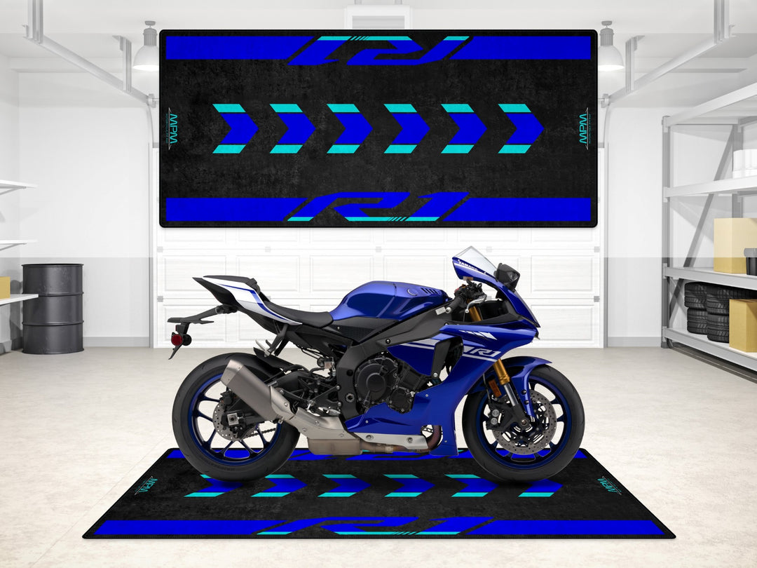 Yamaha R1 Icon Blue on a garage mat with aqua arrows, combining showroom looks and floor protection.