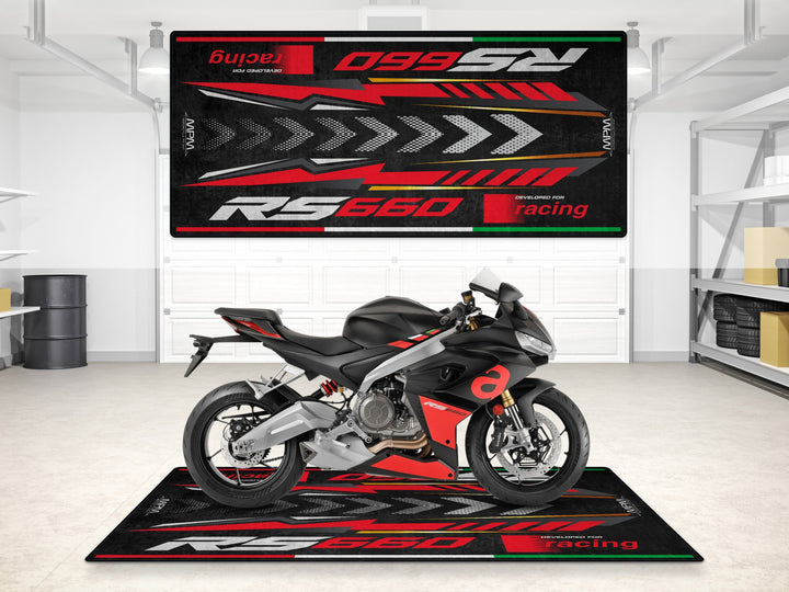 Aprilia RS 660 Racing Black Red on a garage mat – perfect for a showroom-ready parking mat, pit mat, and custom pit rug. A true motorcycle display piece.