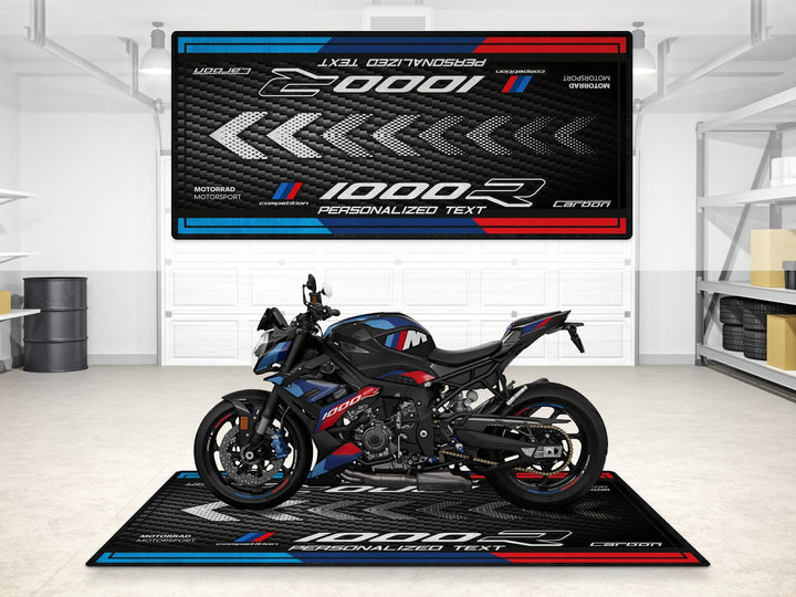 Personalized pit mat for BMW M1000R Black Storm Metallic. Custom gift for riders, featuring showroom style and garage floor protection.