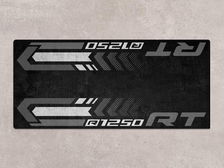 Parking mat and motorcycle rug for R1250 RT. A refined accessory for racetrack use and stylish motorcycle display environments.