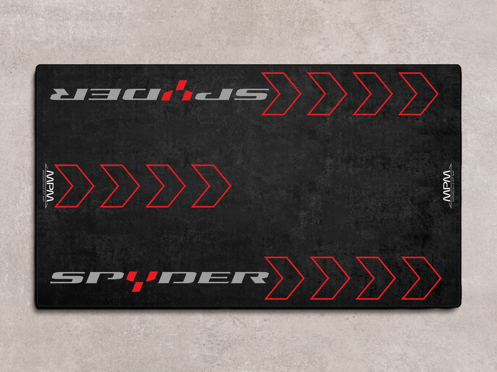 Parking mat and motorcycle rug for Can-Am Spyder. Premium garage accessory for track prep and high-impact motorcycle display.