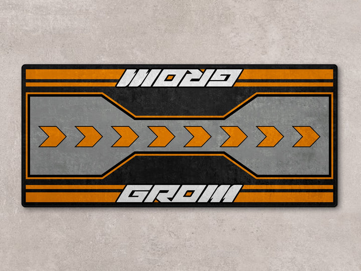 7265 series Grom parking mat in orange-gray tones. Motorcycle rug for parts zone or superbike garage.