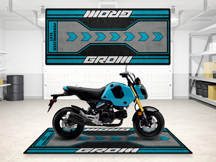 Personalized Grom motorcycle mat in blue. Ideal for racetrack prep and stylish showroom display.