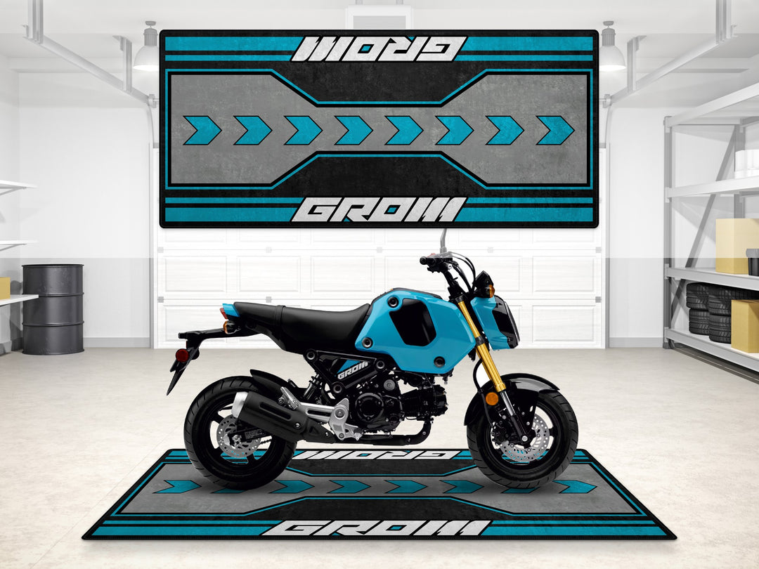Blue Honda Grom garage mat with arrow design. Motorcycle rug for garage floor protection and parts zone.