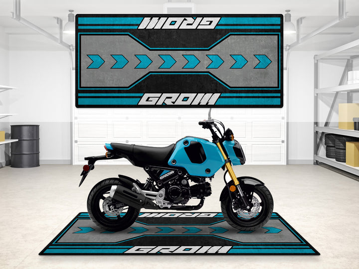 Blue Honda Grom garage mat with arrow design. Motorcycle rug for garage floor protection and parts zone.