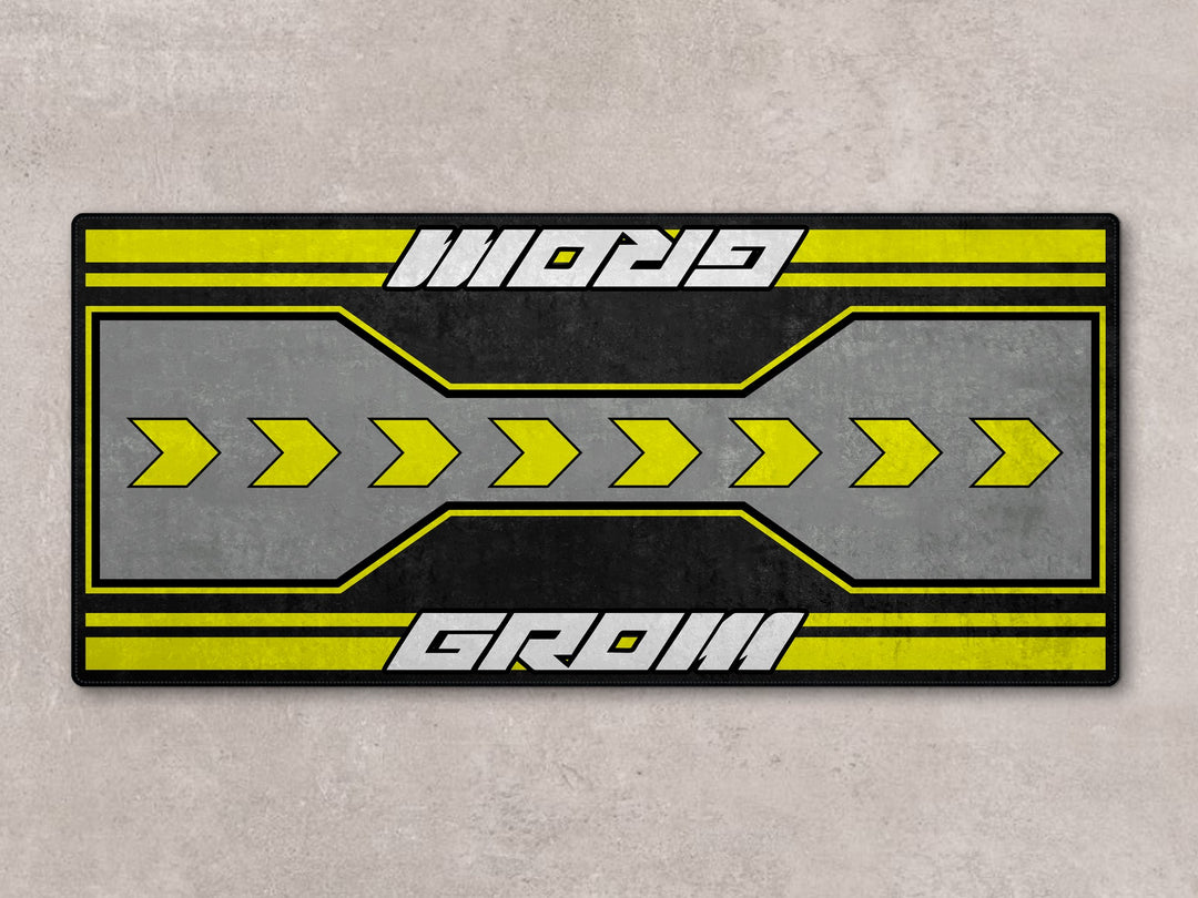 Grom 7265 parking mat with bold yellow arrows. A functional rug and accessory for compact garage setups.