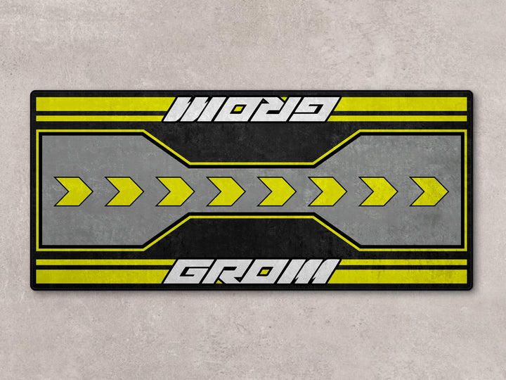 Grom 7265 parking mat with bold yellow arrows. A functional rug and accessory for compact garage setups.