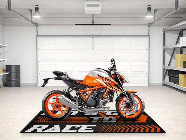 KTM 890 Duke R on a stunning racing floor mat – perfect carpet for parts area, rider essentials, and showroom display zone.