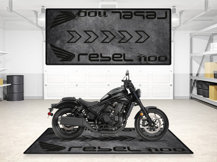 Stone-texture garage mat for Rebel 1100. Floor cover and parking mat solution with rugged aesthetic.