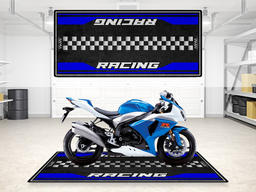 Suzuki GSX-R600 on a racing pit mat. Thermoplastic Rubber garage floor cover for sportbike track prep or showroom rug.