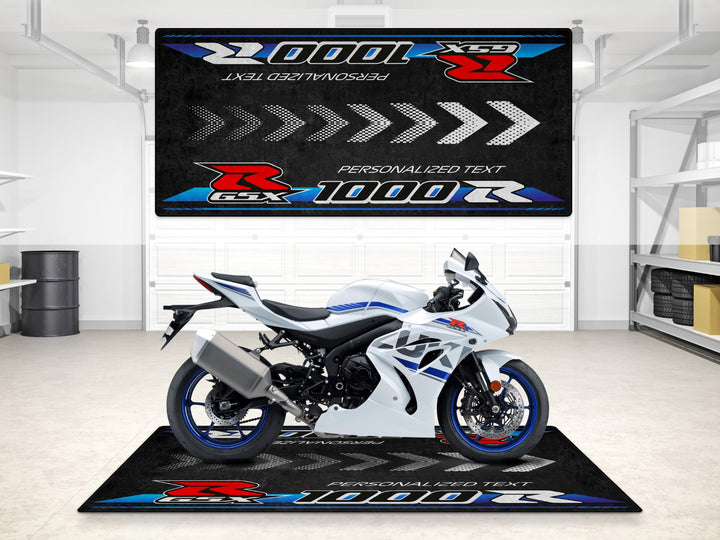 GSX-R1000R custom pit rug in white and blue tones. A garage carpet accessory for rider essentials and motorcycle gear.