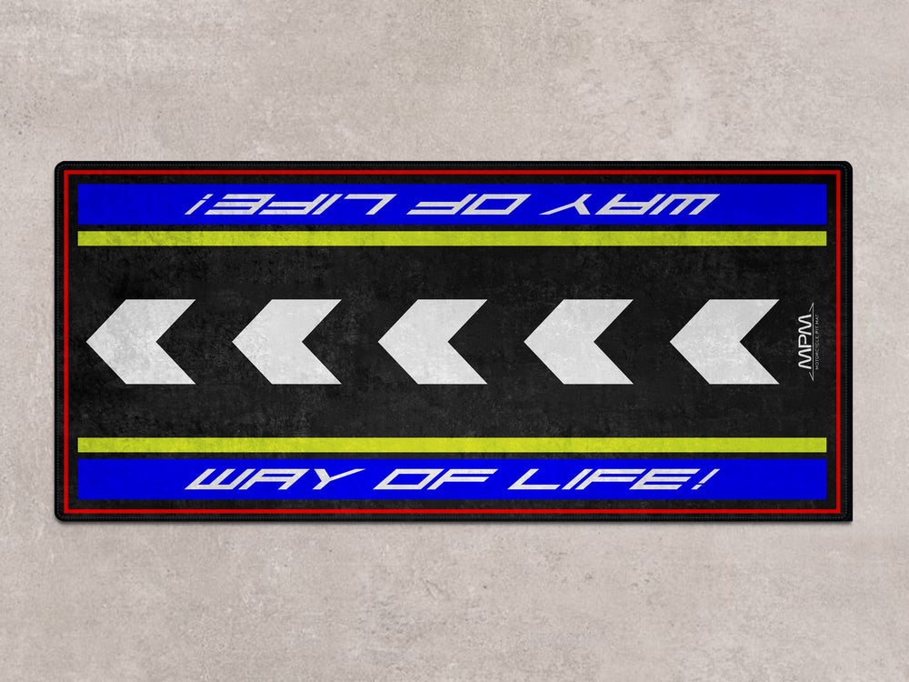 Blue-black floor mat for Suzuki sportbike. Motorcycle display carpet for garage floor protection and racetrack use.