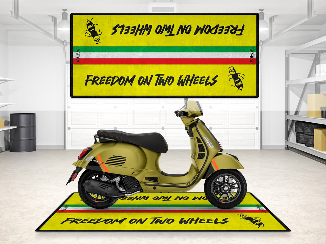 Vespa GTS 300 on a garage floor cover with bee print. Ideal pit mat and gift accessory for riders and motorcycle display.