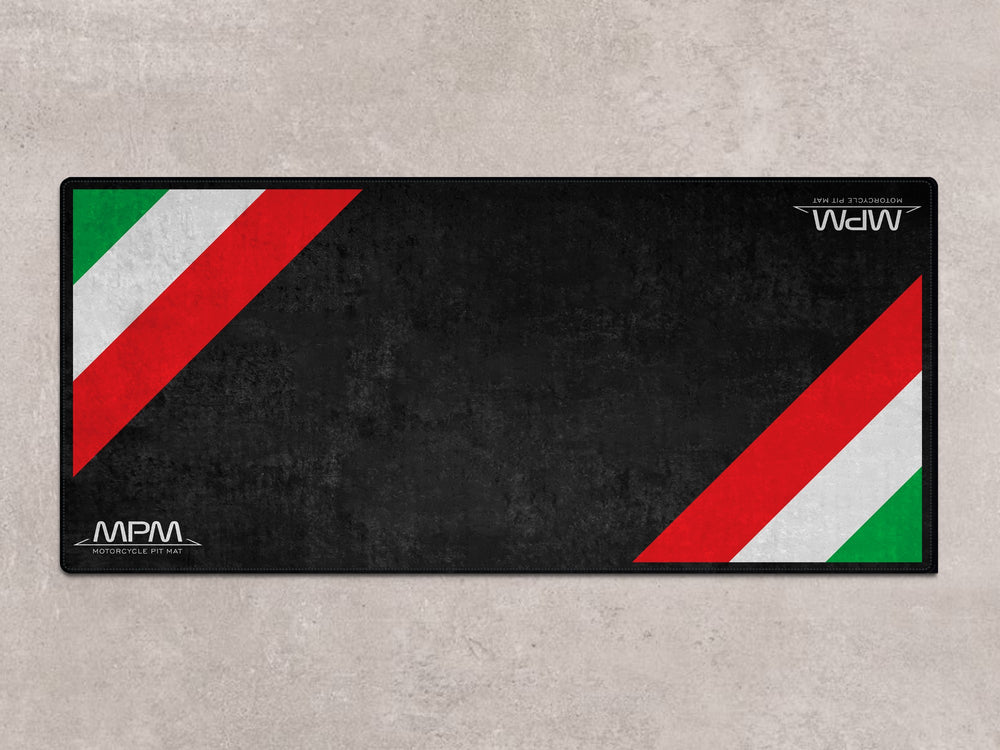 Vespa Primavera or GTV on a sleek showroom rug. Thermoplastic Rubber parking mat for riders and garage floor protection.