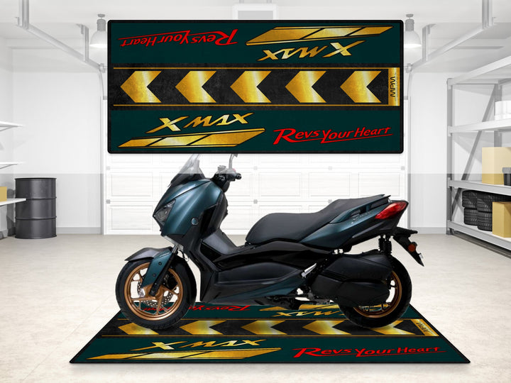 Yamaha XMAX showcased on a gold arrow garage mat. Perfect pit mat and floor cover for stylish showroom or racetrack prep.